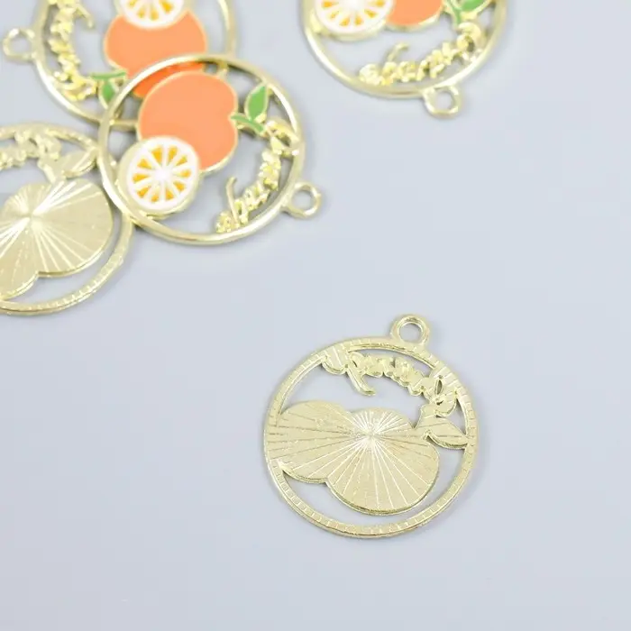 Декор для творчества металл, эмаль "Апельсин и половина апельсина в круге" золото 2,1х2,5 см   93714