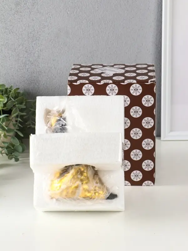 Подсвечник полистоун Подсвечник полистоун "Африканка в золотом платье с цветами" d=4,5 см 10,5х12х16 см