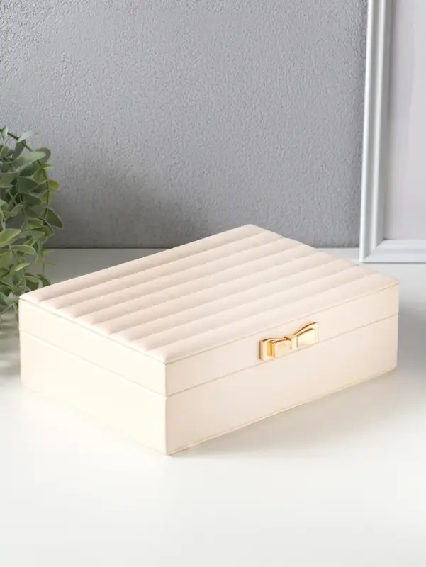 Шкатулка кожзам для украшений "Стёганная. Полоски. Бант" молочный 17х24х7 см
