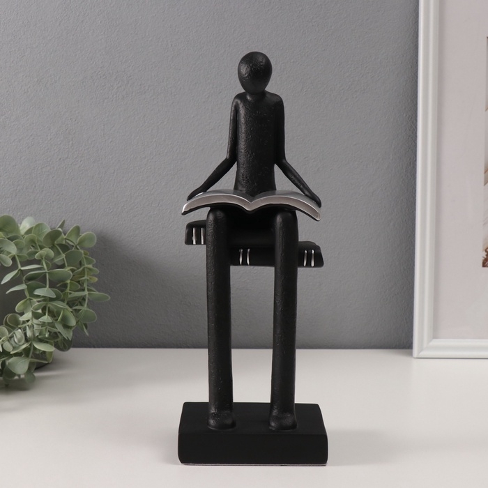 Сувенир полистоун  Сувенир полистоун "Абстракция. Человек сидит на книгах читает" черный с серебром 7,5х11х30см