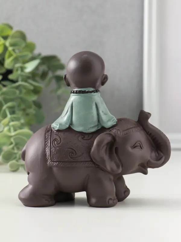 Сувенир полистоун "Маленький будда на слоне" зелёно-коричневый 5,5х12х12 см