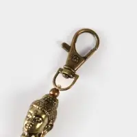 Брелок-кисточка "Будда" 17 см, цв. бежевый, золотистый Брелок-кисточка "Будда" 17 см, цв. бежевый, золотистый