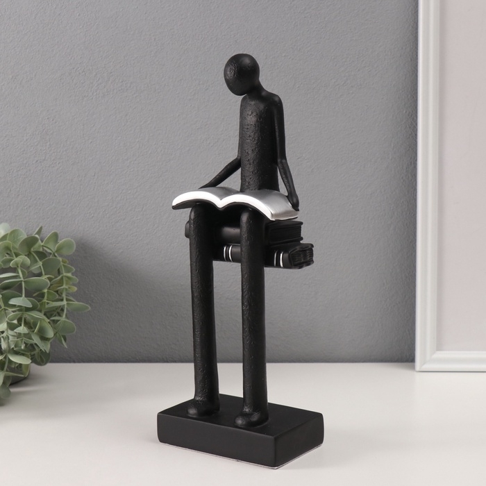 Сувенир полистоун  Сувенир полистоун "Абстракция. Человек сидит на книгах читает" черный с серебром 7,5х11х30см