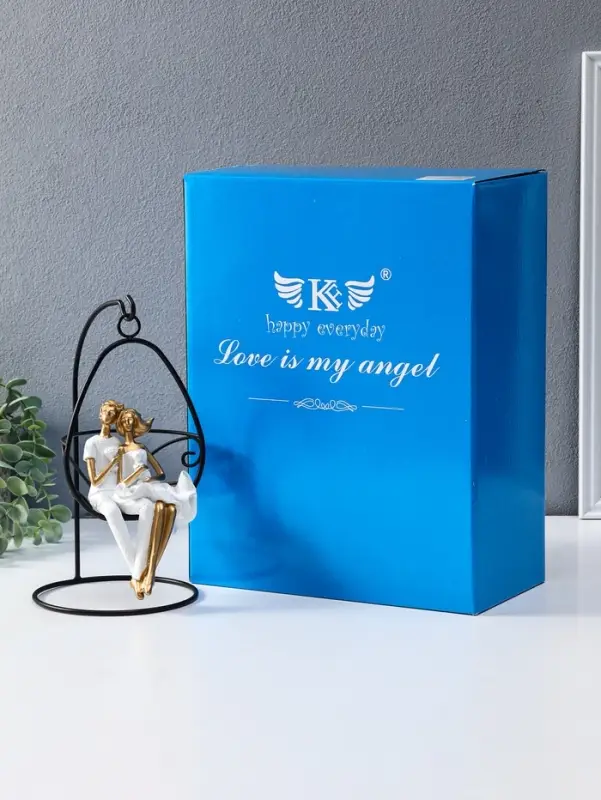 Сувенир полистоун "Парочка качается на качеле" бело-золотой 13,5х13,5х26 см