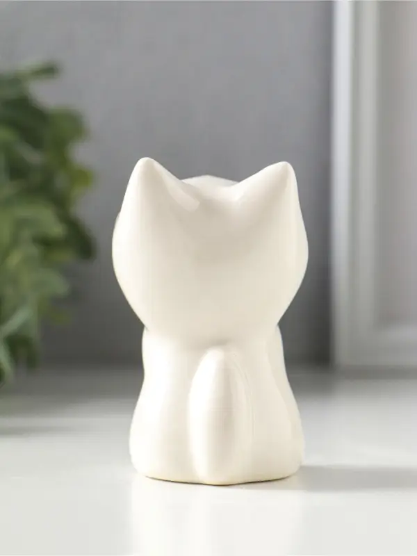 Сувенир керамика "Белый котёнок с желтым цветочком" 5,2х5х7,6 см