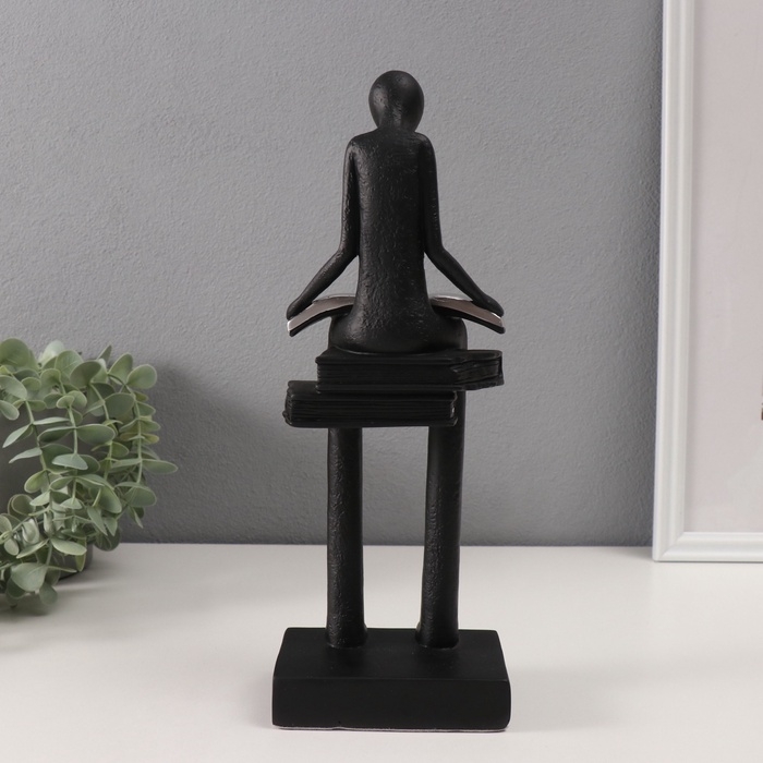 Сувенир полистоун  Сувенир полистоун "Абстракция. Человек сидит на книгах читает" черный с серебром 7,5х11х30см
