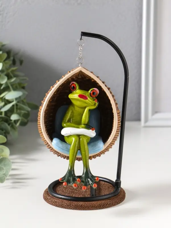 Сувенир полистоун лак "Лягуха в кресле-качеле" 12х11х18 см