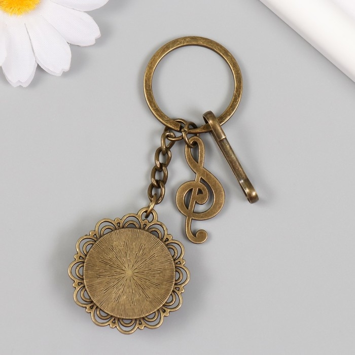 Брелок металл, стекло с карабином "Скрипичный ключ и цветы в медальоне" бронза 9,5 см