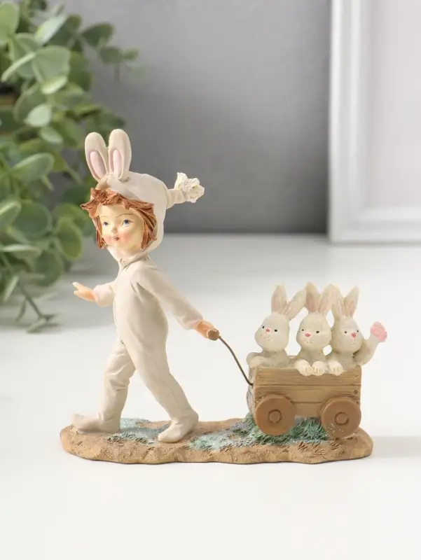 Сувенир полистоун "Девочка в комбинезоне с заячьими ушами, везет тележку с зайцами" 13,5 см   109278