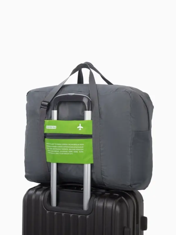 Сумка дорожная на молнии, складная в косметичку, наружный карман, держатель для чемодана, серая, зелёная