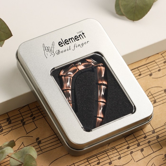 Каподастр для гитары Music Life Череп, бронзовый Каподастр для гитары Music Life Череп, бронзовый