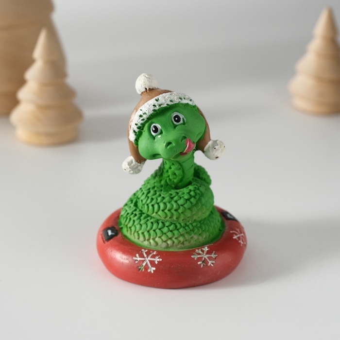 Сувенир полистоун Сувенир полистоун "Змей в шапке-ушанке на тюбинге" 5,2х6 см