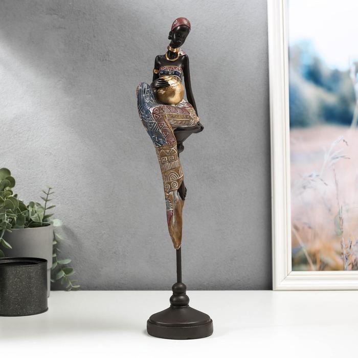 Сувенир полистоун  Сувенир полистоун "Африканка с кувшином, в наряде - геометрия, на стуле" 43х11х9,3 см
