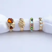 Набор колец с камнями золотистые 4 штуки