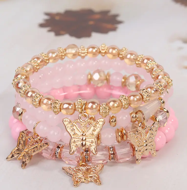 Набор браслетов с подвесками розовые 4 штуки